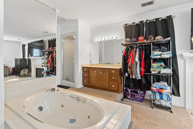 4065 S Goshen Lake Dr, Augusta, GA 30906 - bathroom with a jetted tub, vanity, ornamental molding, a stall shower, and visible vents
