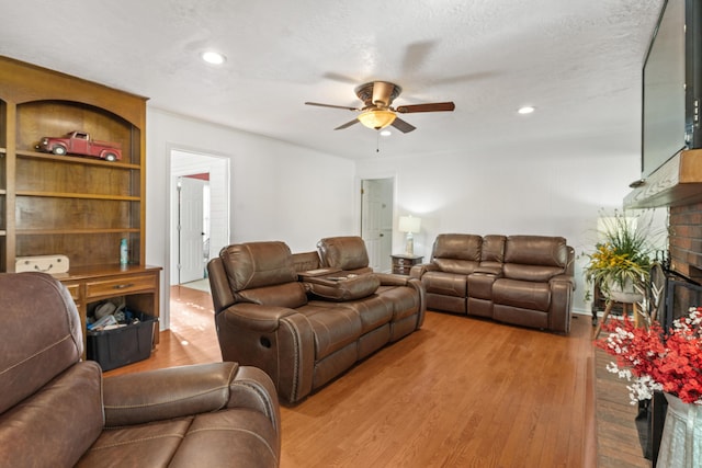 4065 S Goshen Lake Dr, Augusta, GA 30906 - living room featuring ceiling fan, recessed lighting, wood finished floors, and a fireplace