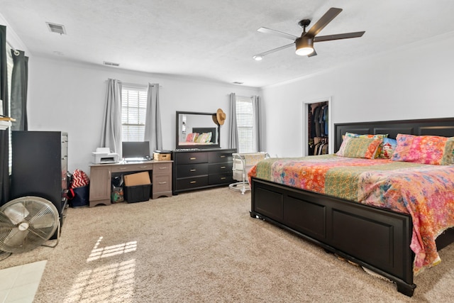 4065 S Goshen Lake Dr, Augusta, GA 30906 - bedroom featuring visible vents, a walk in closet, carpet flooring, and a ceiling fan