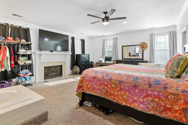 4065 S Goshen Lake Dr, Augusta, GA 30906 - bedroom featuring a spacious closet, a ceiling fan, carpet floors, a fireplace with flush hearth, and visible vents