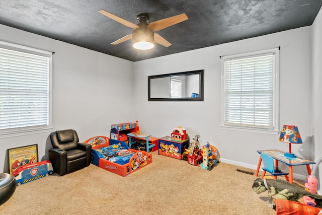 4065 S Goshen Lake Dr, Augusta, GA 30906 - rec room with a wealth of natural light, ceiling fan, visible vents, and carpet floors