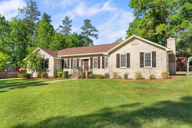 4065 S Goshen Lake Dr, Augusta, GA 30906 - single story home featuring brick siding, a chimney, and a front lawn