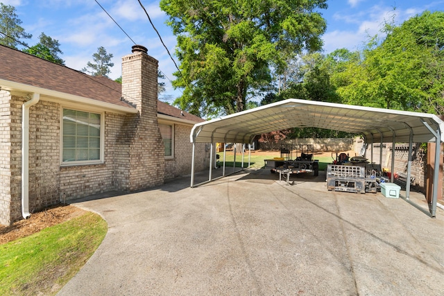 4065 S Goshen Lake Dr, Augusta, GA 30906 - view of vehicle parking featuring a carport, fence, and aphalt driveway
