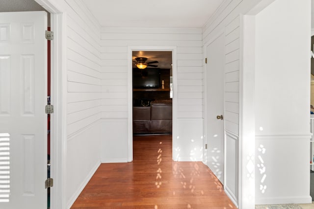 4065 S Goshen Lake Dr, Augusta, GA 30906 - hall with wooden walls, ornamental molding, and wood finished floors