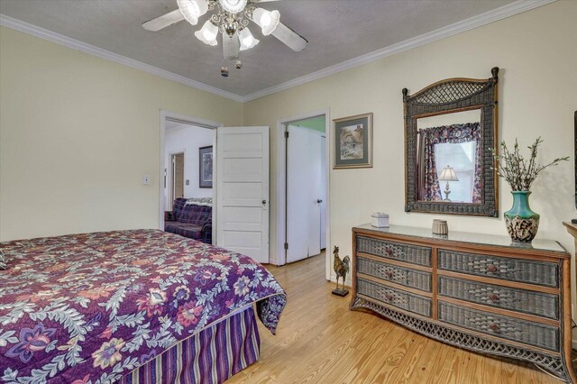 bedroom featuring a textured ceiling, ceiling fan, and crown molding