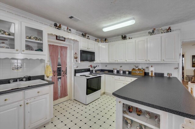 kitchen featuring a textured ceiling, electric range, white cabinetry, and sink