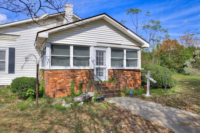 view of front of property with a sunroom