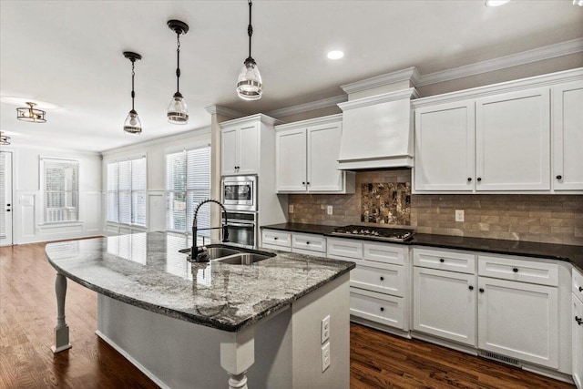 304 Ash Ct, Evans, GA 30809 - kitchen featuring a sink, appliances with stainless steel finishes, custom exhaust hood, and ornamental molding