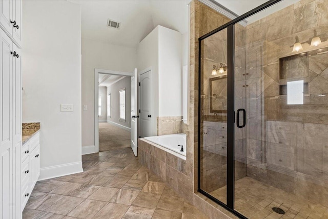 304 Ash Ct, Evans, GA 30809 - full bathroom with visible vents, baseboards, a bath, and a shower stall