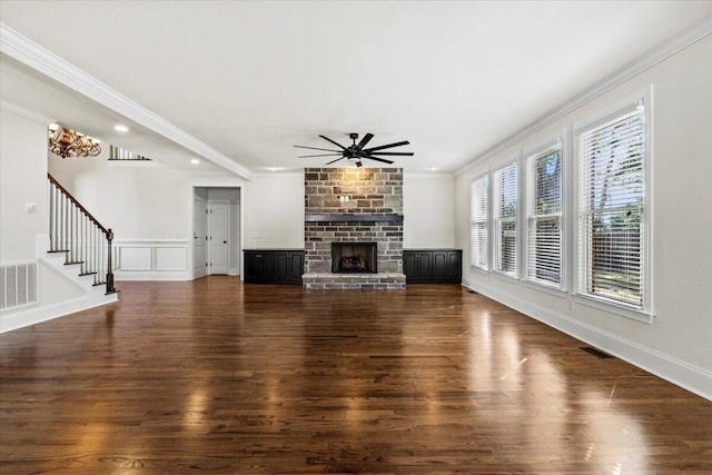 304 Ash Ct, Evans, GA 30809 - unfurnished living room featuring crown molding, a ceiling fan, wood finished floors, visible vents, and stairway