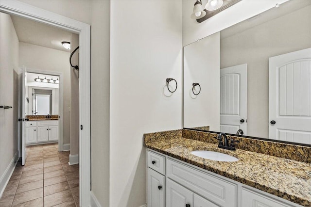 304 Ash Ct, Evans, GA 30809 - bathroom with baseboards, tile patterned flooring, and vanity