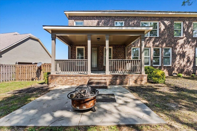 304 Ash Ct, Evans, GA 30809 - view of front of property with fence, a porch, a fire pit, and brick siding