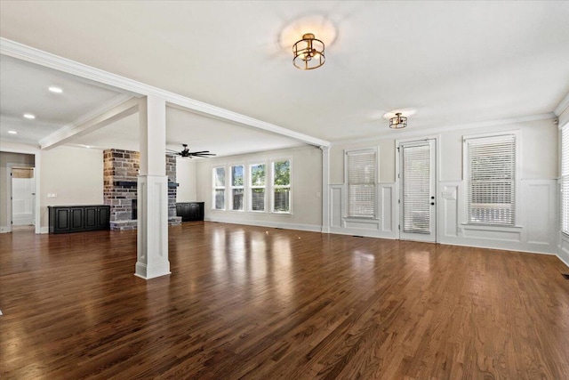 304 Ash Ct, Evans, GA 30809 - unfurnished living room with crown molding, wood finished floors, and a fireplace