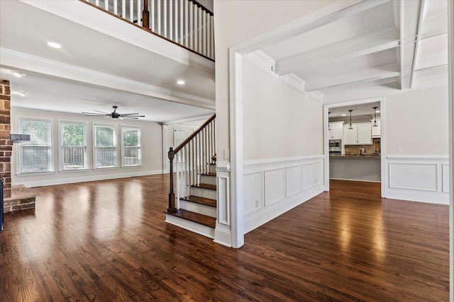 304 Ash Ct, Evans, GA 30809 - staircase featuring a ceiling fan, a decorative wall, wood finished floors, and beam ceiling