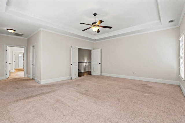 304 Ash Ct, Evans, GA 30809 - unfurnished bedroom with crown molding, a raised ceiling, and visible vents