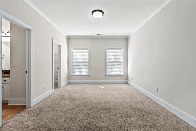 304 Ash Ct, Evans, GA 30809 - spare room with crown molding, baseboards, and light carpet