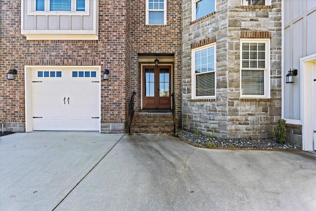 304 Ash Ct, Evans, GA 30809 - view of exterior entry with an attached garage, driveway, and brick siding