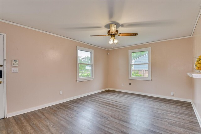2325 Henry Cir, Augusta, GA 30906 - spare room featuring healthy amount of natural light, ornamental molding, wood finished floors, baseboards, and a ceiling fan