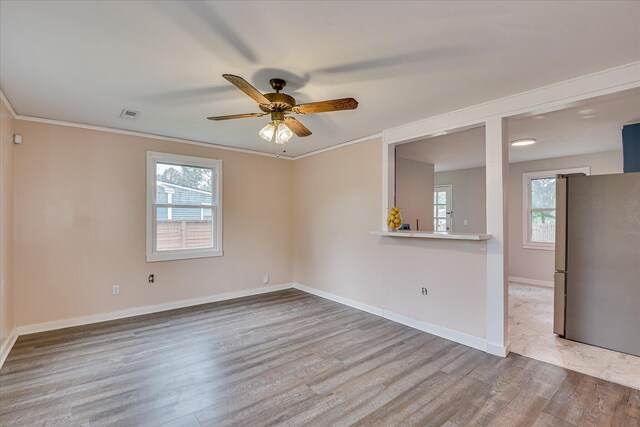 2325 Henry Cir, Augusta, GA 30906 - spare room with wood finished floors, ceiling fan, baseboards, and ornamental molding