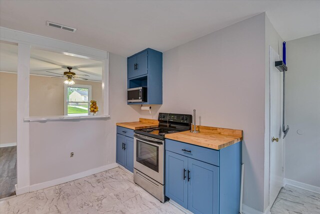 2325 Henry Cir, Augusta, GA 30906 - kitchen featuring appliances with stainless steel finishes, butcher block counters, blue cabinetry, and light marble finish floors