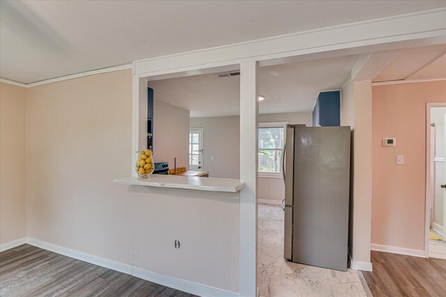 2325 Henry Cir, Augusta, GA 30906 - kitchen with freestanding refrigerator, wood finished floors, baseboards, and light countertops