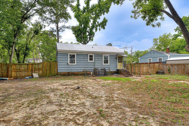 2325 Henry Cir, Augusta, GA 30906 - rear view of property with a fenced backyard and central AC unit