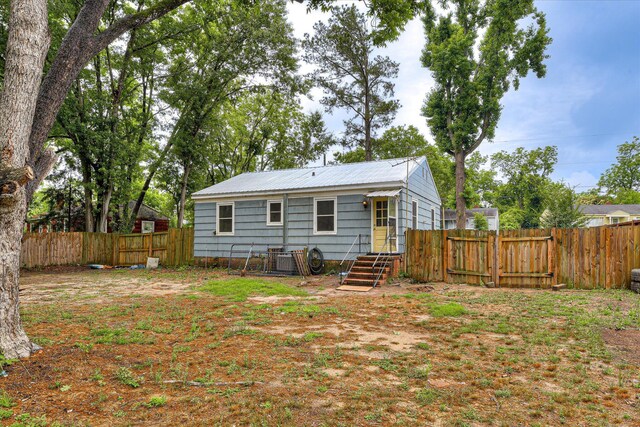 2325 Henry Cir, Augusta, GA 30906 - back of property featuring a fenced backyard and metal roof