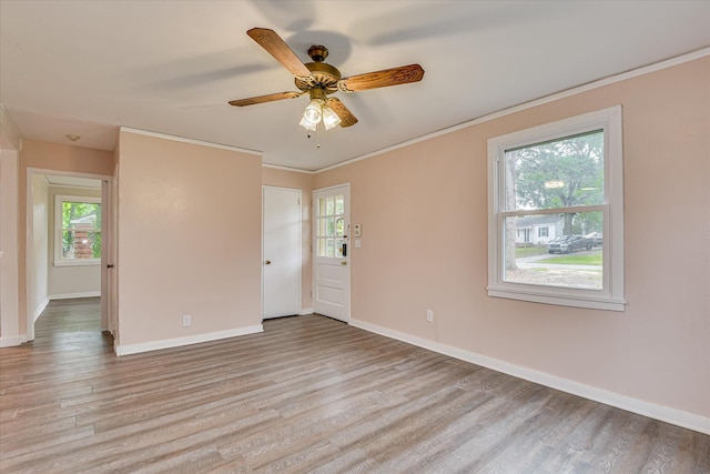 2325 Henry Cir, Augusta, GA 30906 - unfurnished room with healthy amount of natural light, light wood-style flooring, baseboards, and crown molding