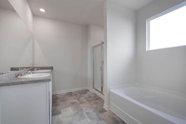 bathroom featuring vanity and shower with separate bathtub