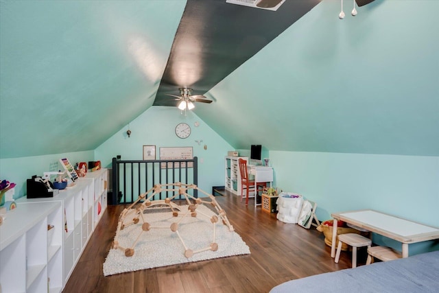 bedroom with lofted ceiling, wood finished floors, and a ceiling fan