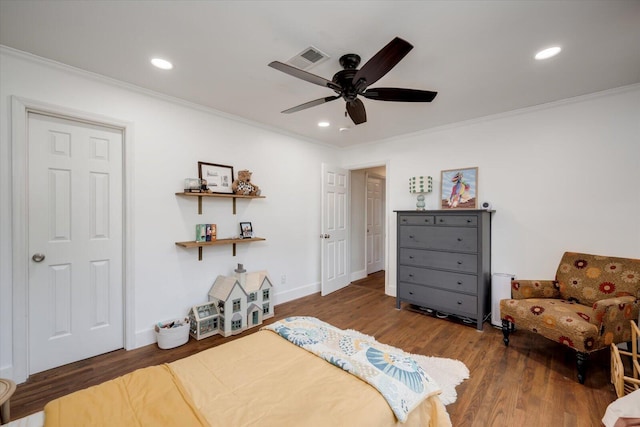 bedroom featuring ornamental molding, wood finished floors, visible vents, and recessed lighting