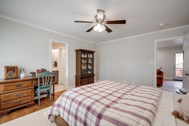 bedroom with baseboards, ceiling fan, wood finished floors, and crown molding