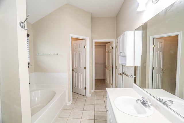 944 Cannock St, Grovetown, GA 30813 - bathroom featuring vanity, a bath, tile patterned floors, a closet, and lofted ceiling