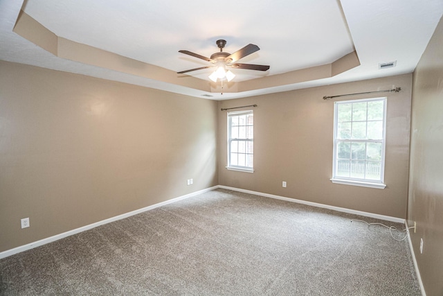 944 Cannock St, Grovetown, GA 30813 - carpeted spare room with a tray ceiling, a ceiling fan, and plenty of natural light