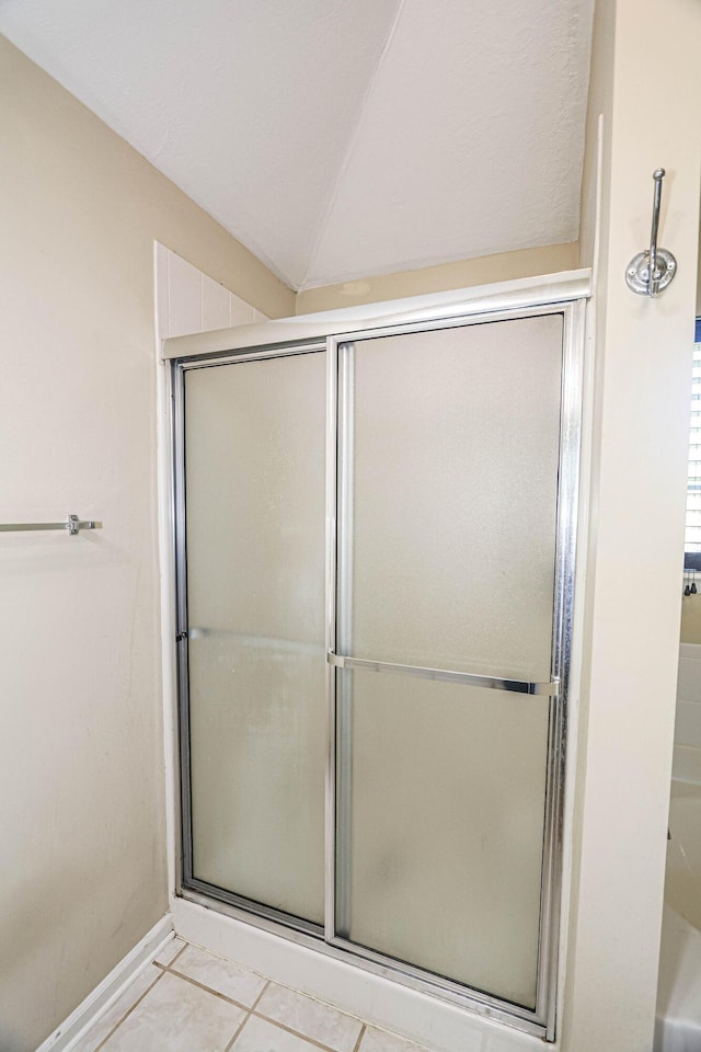 944 Cannock St, Grovetown, GA 30813 - full bathroom featuring a shower with shower door, lofted ceiling, and tile patterned flooring