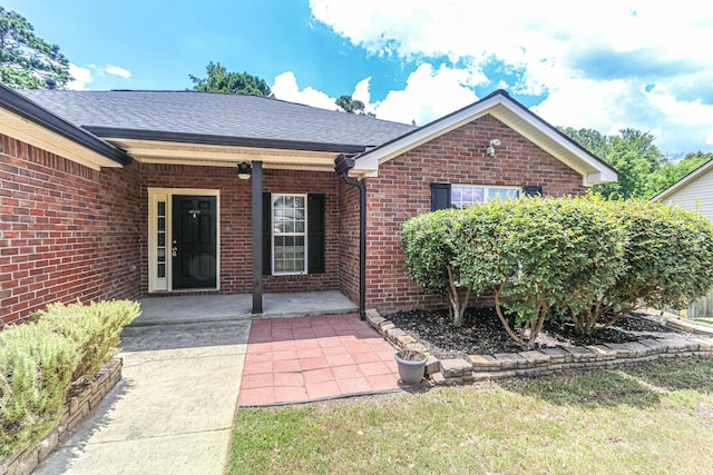 944 Cannock St, Grovetown, GA 30813 - doorway to property with brick siding, roof with shingles, and covered porch