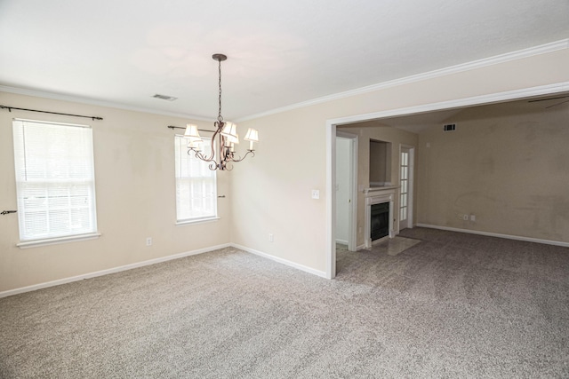 944 Cannock St, Grovetown, GA 30813 - carpeted spare room with crown molding, a chandelier, and a fireplace with flush hearth