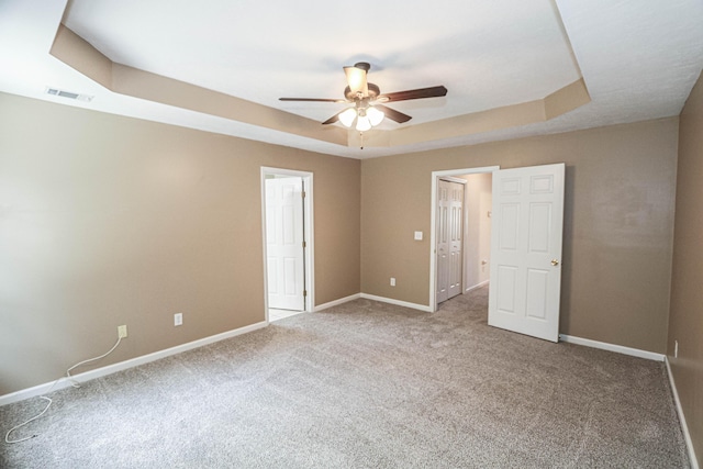 944 Cannock St, Grovetown, GA 30813 - unfurnished bedroom with carpet floors, a tray ceiling, and ceiling fan