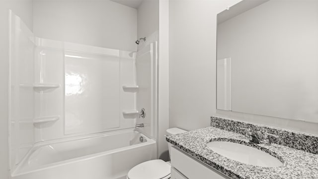 full bath featuring toilet, vanity, and bathing tub / shower combination