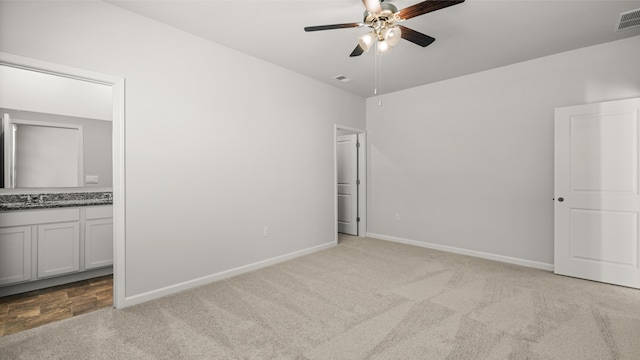 unfurnished bedroom featuring baseboards, carpet floors, and a closet