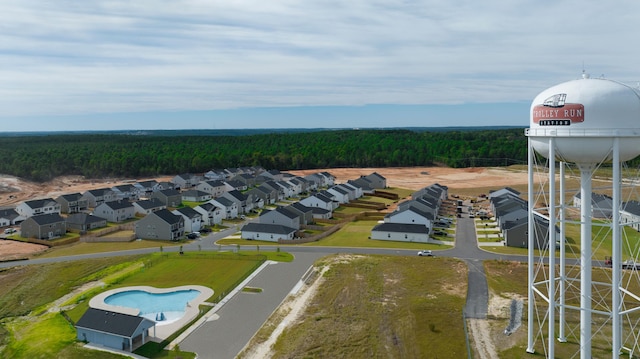 bird's eye view with a residential view and a wooded view