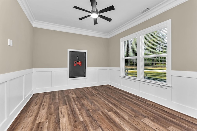2120 Shell Point Ct, Harlem, GA 30814 - empty room with crown molding, dark wood-style flooring, a ceiling fan, a wainscoted wall, and a decorative wall