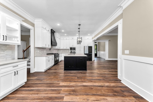 2120 Shell Point Ct, Harlem, GA 30814 - kitchen with black gas stove, custom exhaust hood, a sink, tasteful backsplash, and crown molding