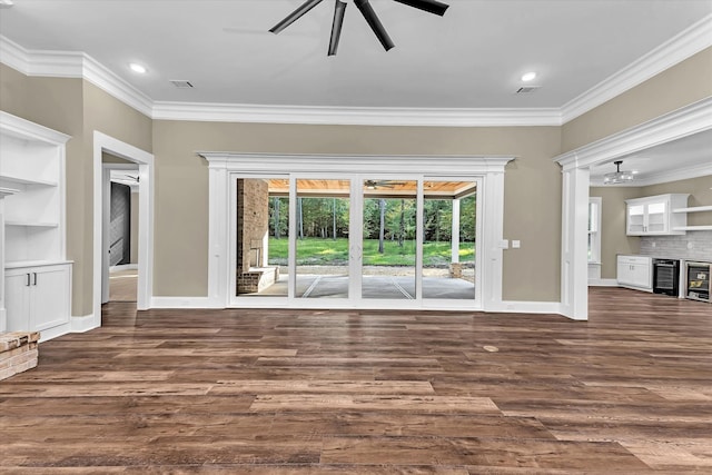 2120 Shell Point Ct, Harlem, GA 30814 - unfurnished living room featuring dark wood-type flooring, ornamental molding, baseboards, wine cooler, and recessed lighting