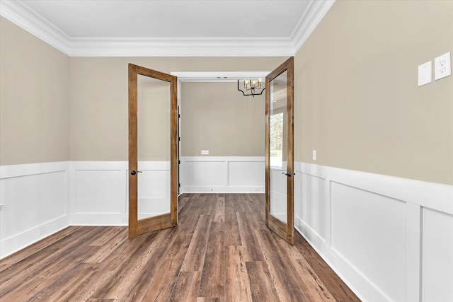 2120 Shell Point Ct, Harlem, GA 30814 - spare room with a chandelier, ornamental molding, french doors, dark wood-type flooring, and a wainscoted wall