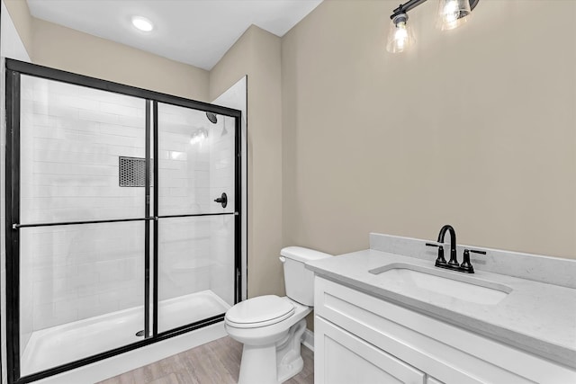 2120 Shell Point Ct, Harlem, GA 30814 - bathroom with toilet, a shower stall, wood finished floors, and vanity