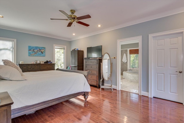 bedroom with crown molding, baseboards, wood finished floors, and recessed lighting