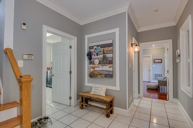 corridor featuring stairs, visible vents, ornamental molding, and light tile patterned flooring