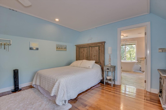 bedroom with light wood finished floors and baseboards