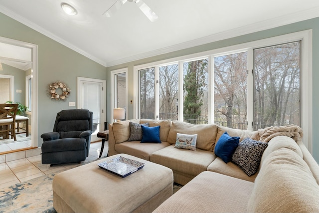 living area featuring ornamental molding, lofted ceiling, ceiling fan, and tile patterned floors